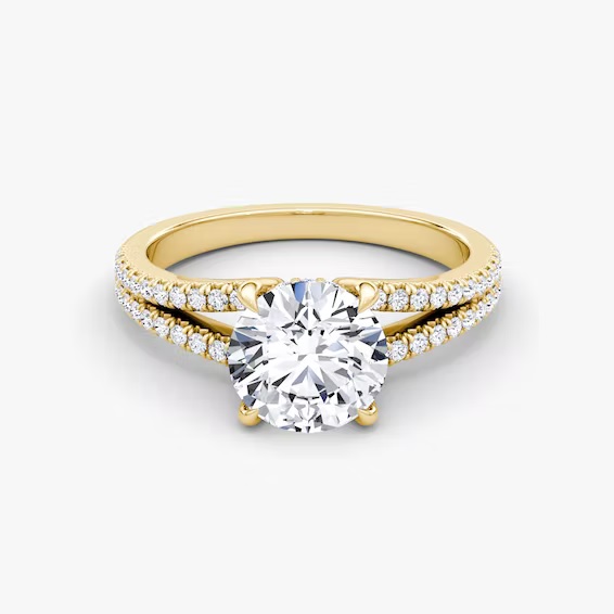 VRAI - The Floating Split Band Round Brilliant Engagement Ring

https://www.vrai.com/engagement-rings/floating-split-band-ring/round-brilliant/yellow-gold?flow=setting&bandAccent=pave